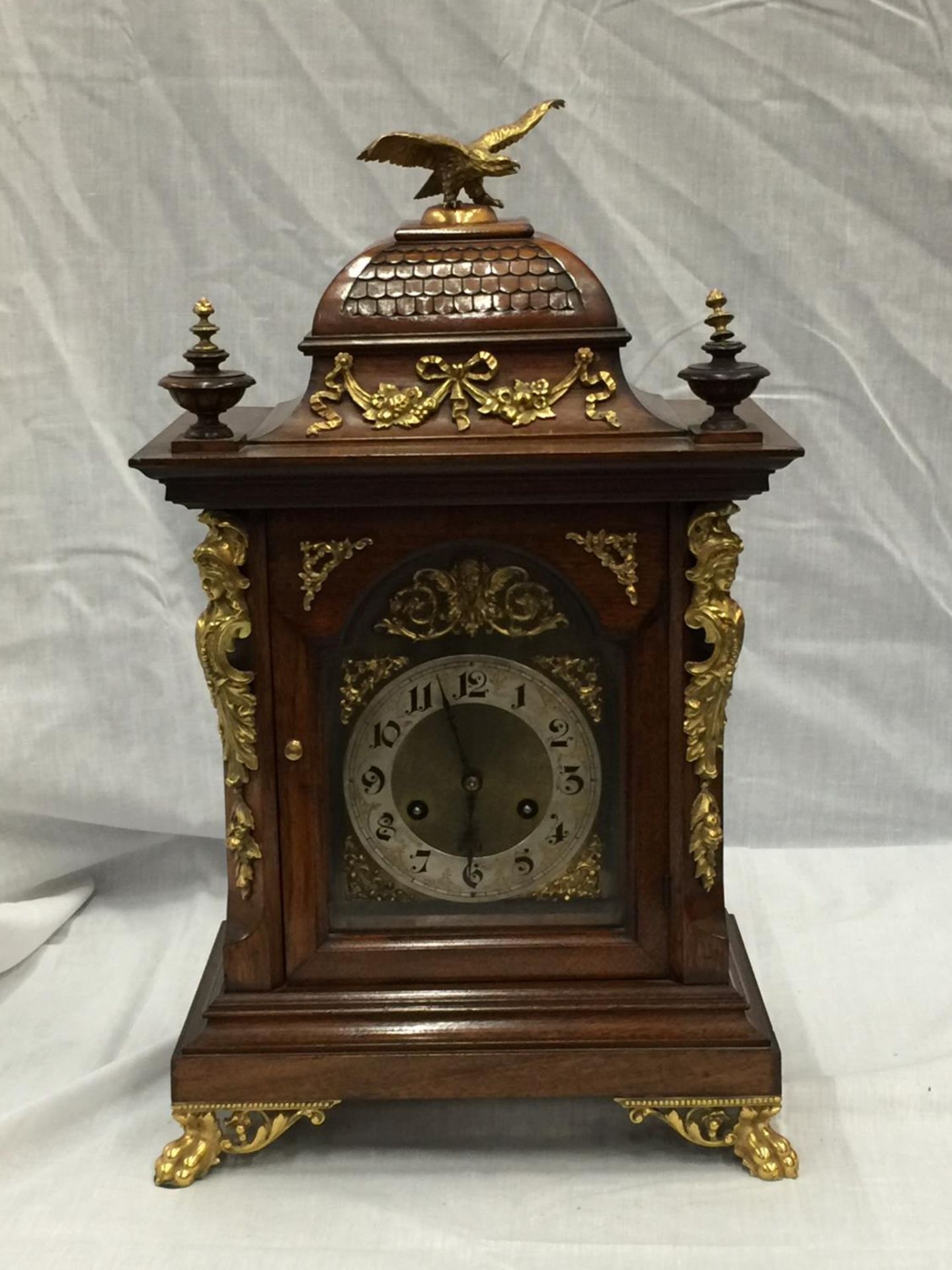 A 19TH CENTURY MAHOGANY CASED BRACKET CLOCK WITH FULL BRASS DIAL AND SILVER CHAPTER RING ORMOLA