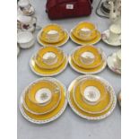 A QUANTITY OF WETLEY CHINA CUPS, SAUCERS AND PLATES IN A VIBRANT YELLOW AND GUILD COLOUR