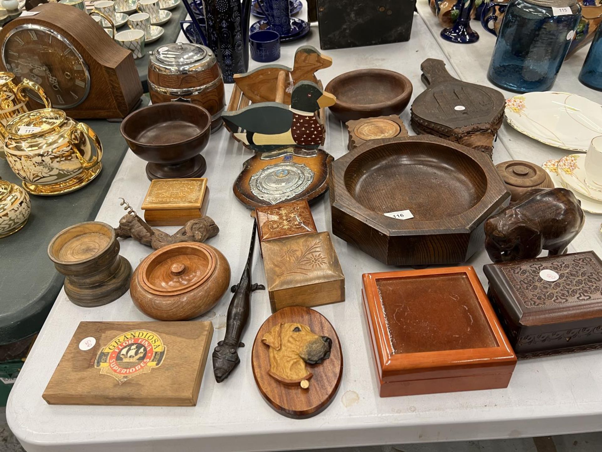 A LARGE QUANTITY OF TREEN ITEMS TO INCLUDE BOWLS, 'DUCK' CONTAINER, BOXES, SHIELD, BELLOWS, ETC