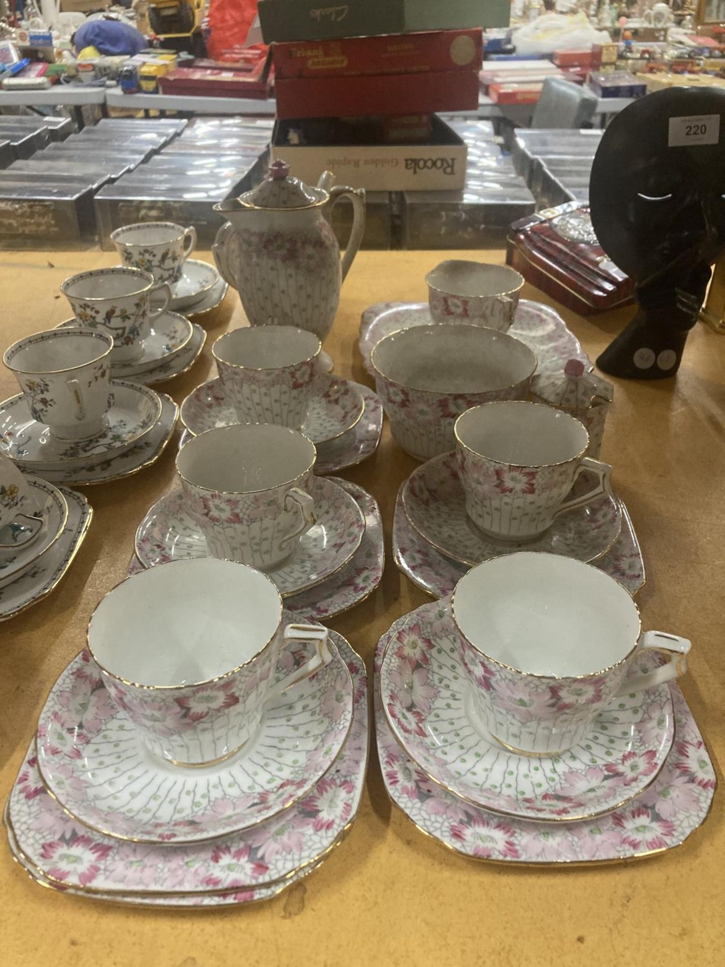 A DELPHINE CHINA TEA AND COFFEE SET IN A PALE PINK FLORAL PATTERN TO INCLUDE A TEA POT, COFFEE