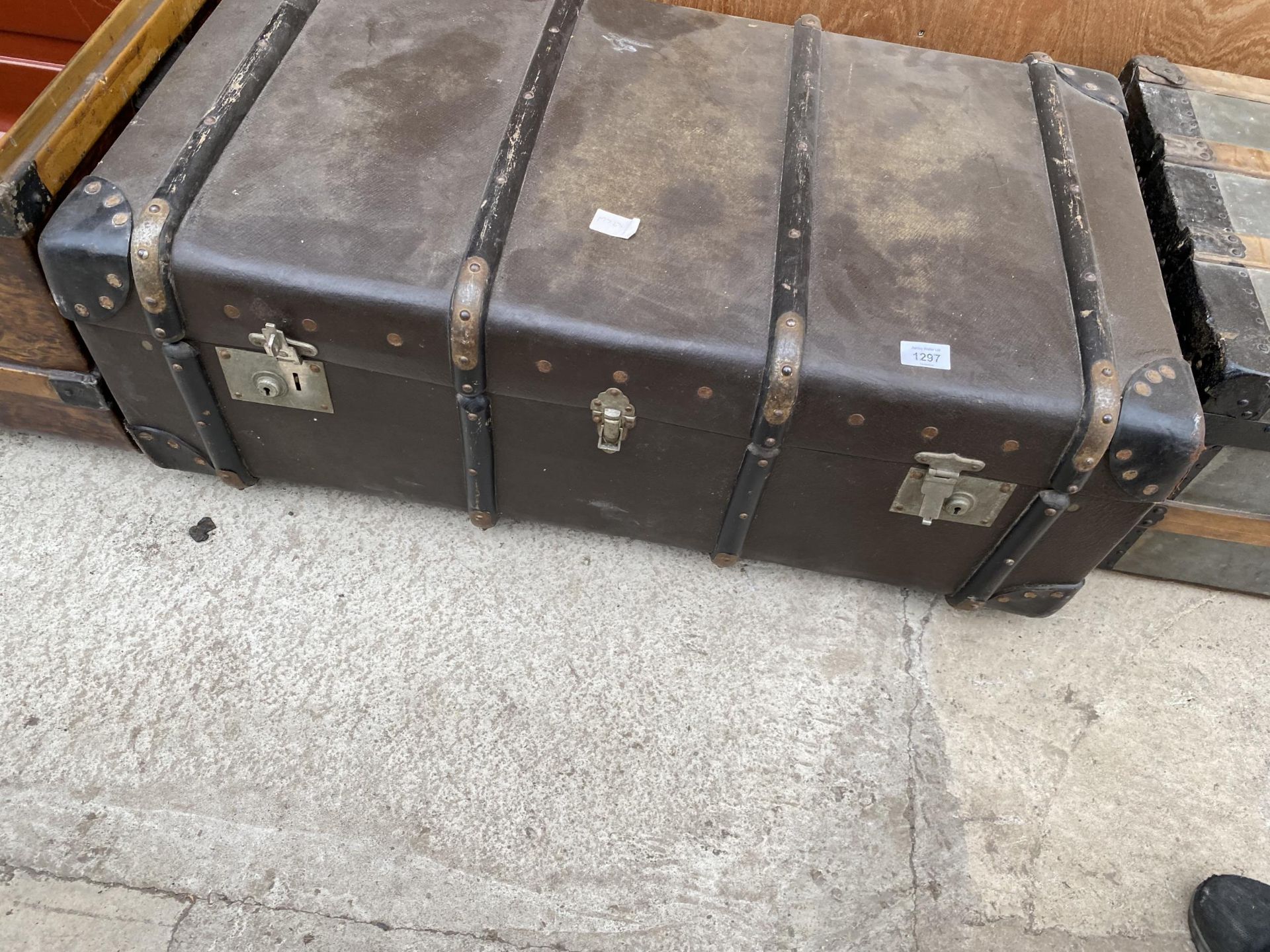 A VINTAGE WOODEN BANDED TRAVEL TRUNK