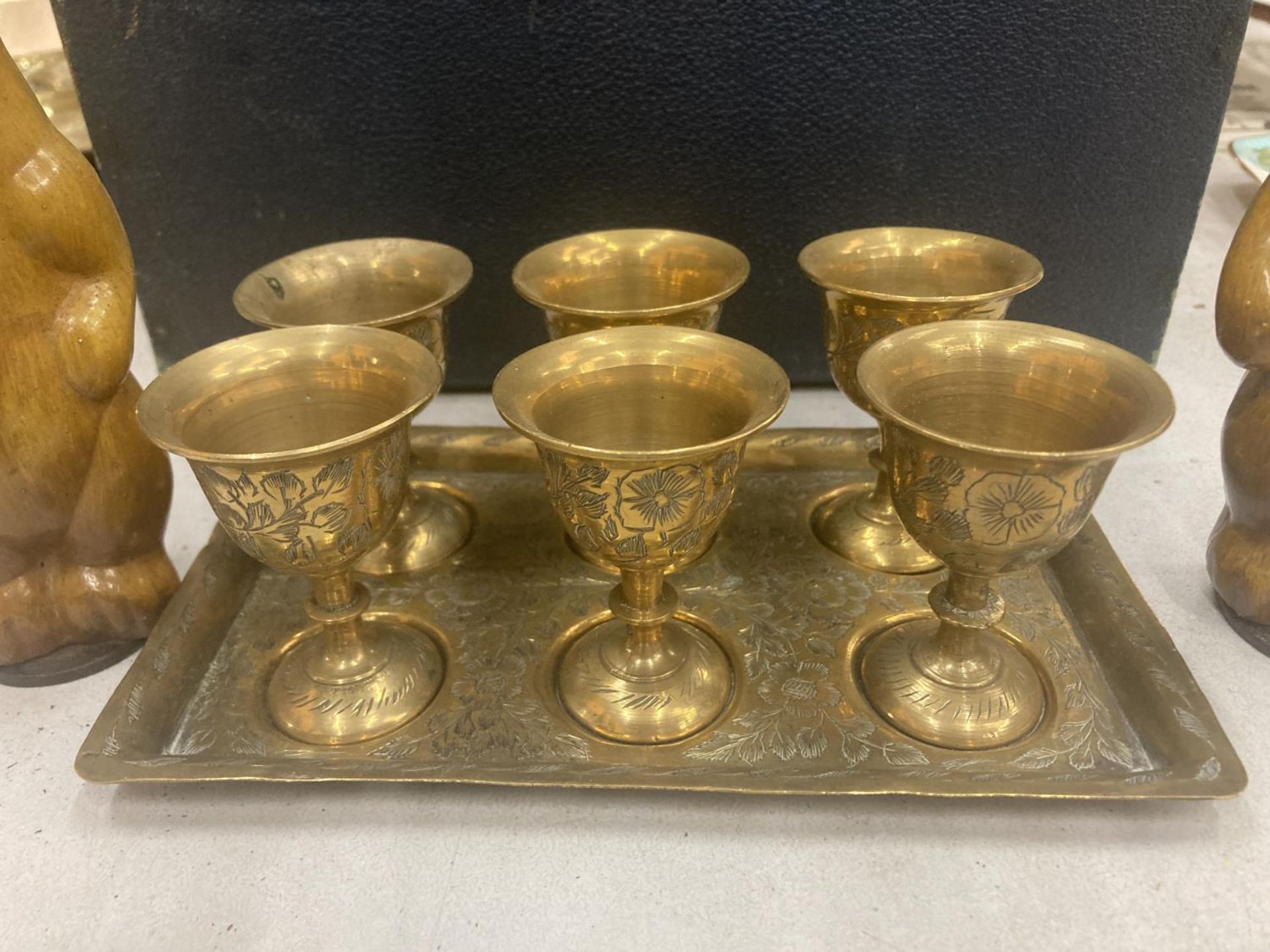 A VINTAGE BLUE CASE TO INCLUDE A BRASS TRAY CONTAINING SIX SMALL GOBLETS, HORSE PLAQUE, CARVED - Image 3 of 5