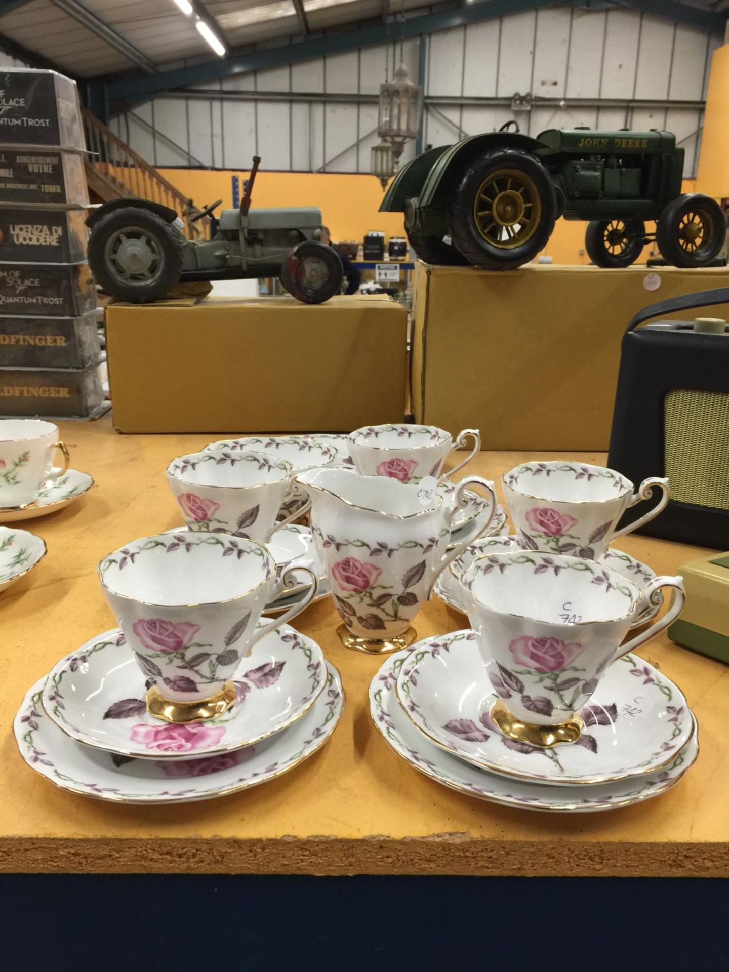 A ROYAL STANDARD 'ROSE MAXI' TEASET TO INCLUDE A CAKE PLATE, CREAM JUG, SUGAR BOWL, FIVE CUPS,