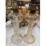 A PAIR OF VINTAGE GLASS OIL LAMPS WITH BARLEY TWIST STEM