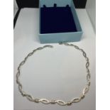 A MARKED SILVER NECKLACE IN A PRESENTATION BOX