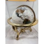 A GLOBE WITH MOTHER OF PEARL INLAYS ON BRASS ROTATING STAND H: 51CM