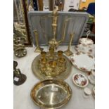 A BRASS AND JEWELLED DALLAH AFTABA POT AND GOBLETS ON TRAY TOGETHER WITH TWO BRASS CANDLESTICKS