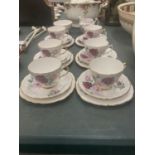 A CROWN REGENT PART TEASET WITH ROSES DESIGN AND GILT AROUND THE RIMS AND HANDLES TO INCLUDE CREAM