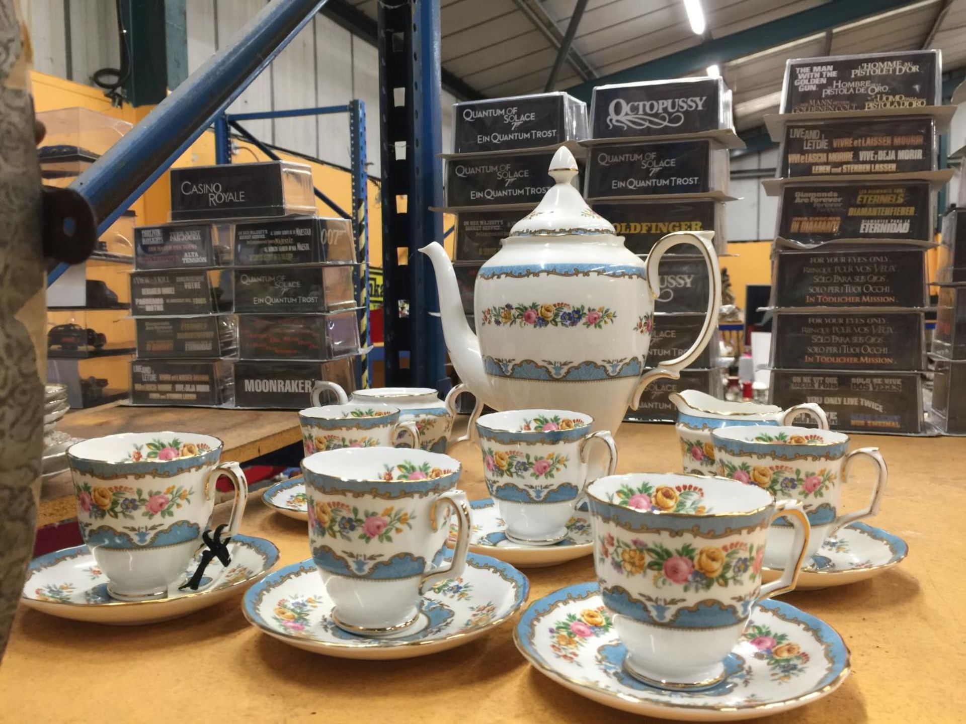 A CROWN STAFFORDSHIRE COFFEE SET IN A BLUE AND FLORAL PATTERN TO INCLUDE A COFFEE POT, CREAM JUG,