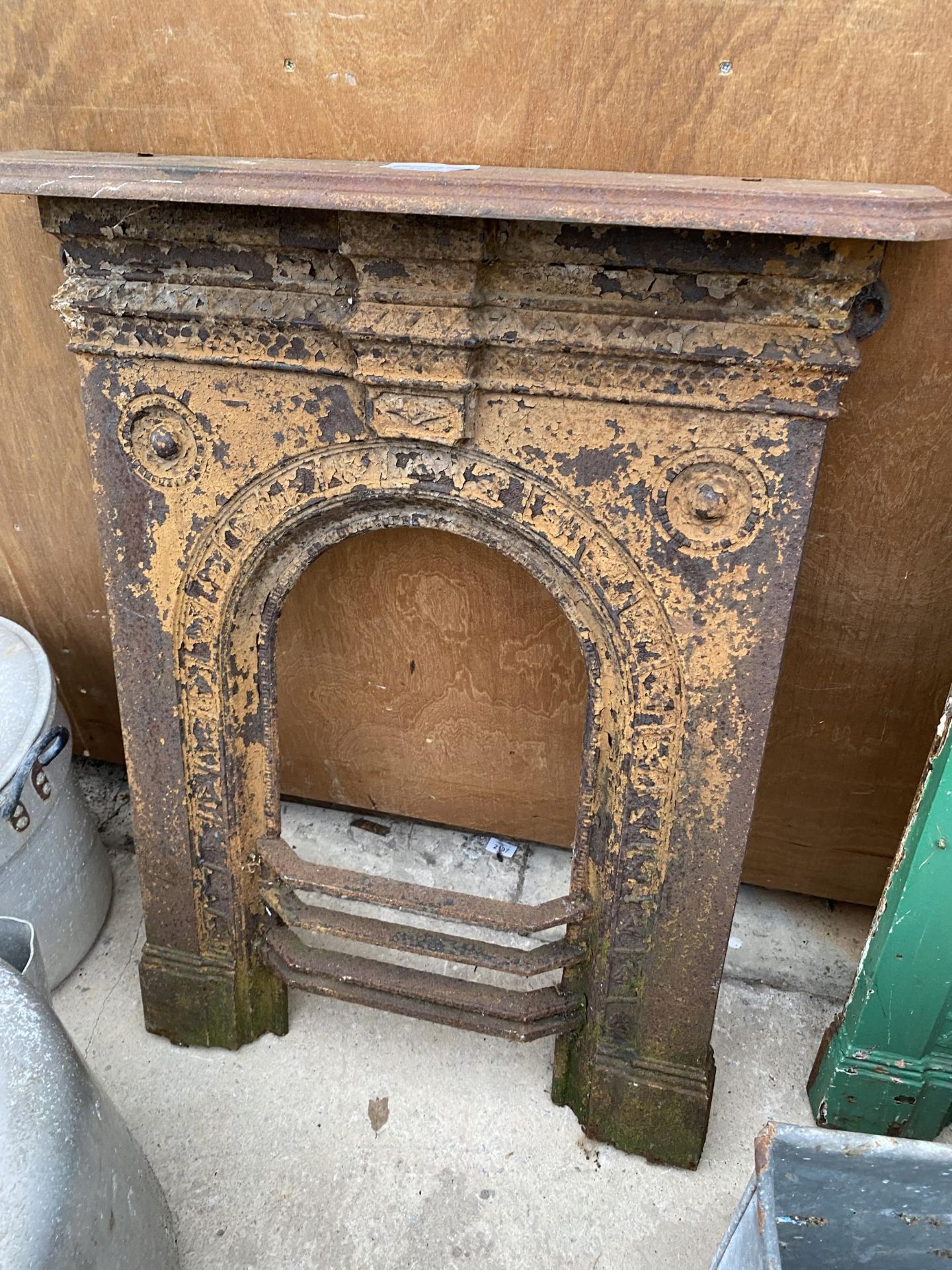 A DECORATIVE CAST IRON FIRE PLACE