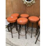 A SET OF FOUR RETRO ORANGE STOOLS WITH METAL LEGS