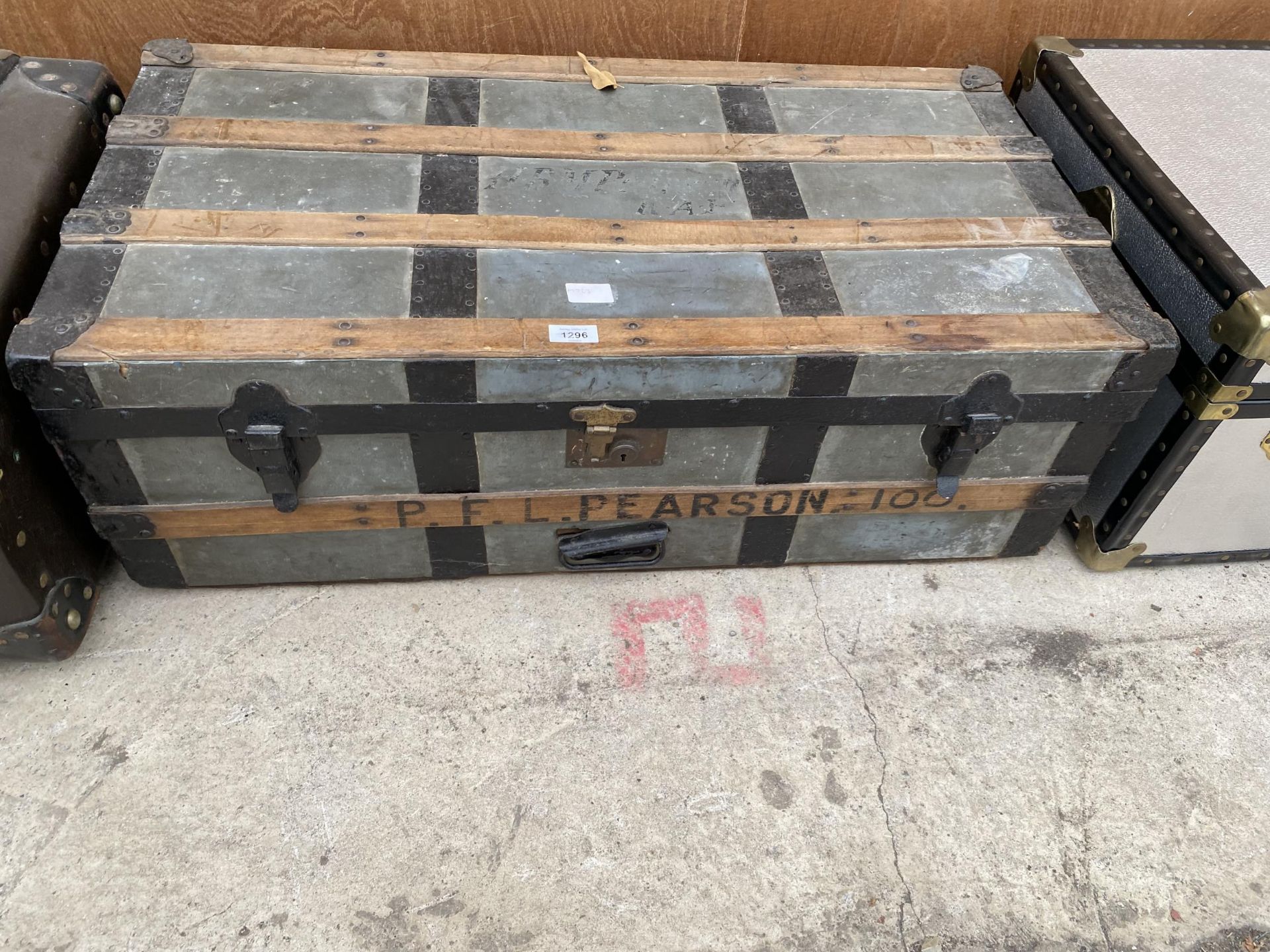 A VINTAGE WOODEN BANDED TRAVEL TRUNK