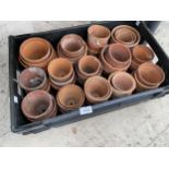 A COLLECTION OF SMALL TERRACOTTA PLANT POTS