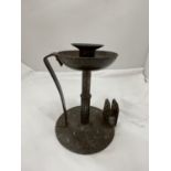 A VINTAGE CANDLESTICK WITH MATCHBOX HOLDER