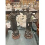 TWO METAL SCULPTURES ON BASES OF A COUPLE GATHERING FLOWERS HEIGHT APPROX 33CM