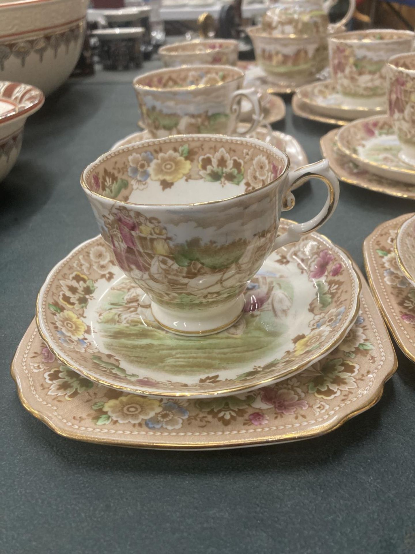 A TUSCAN TEASET WITH A COACHING SCENE DESIGN TO INCLUDE A CAKE PLATE, CREAM JUG, SUGAR BOWL, CUPS, - Image 2 of 5