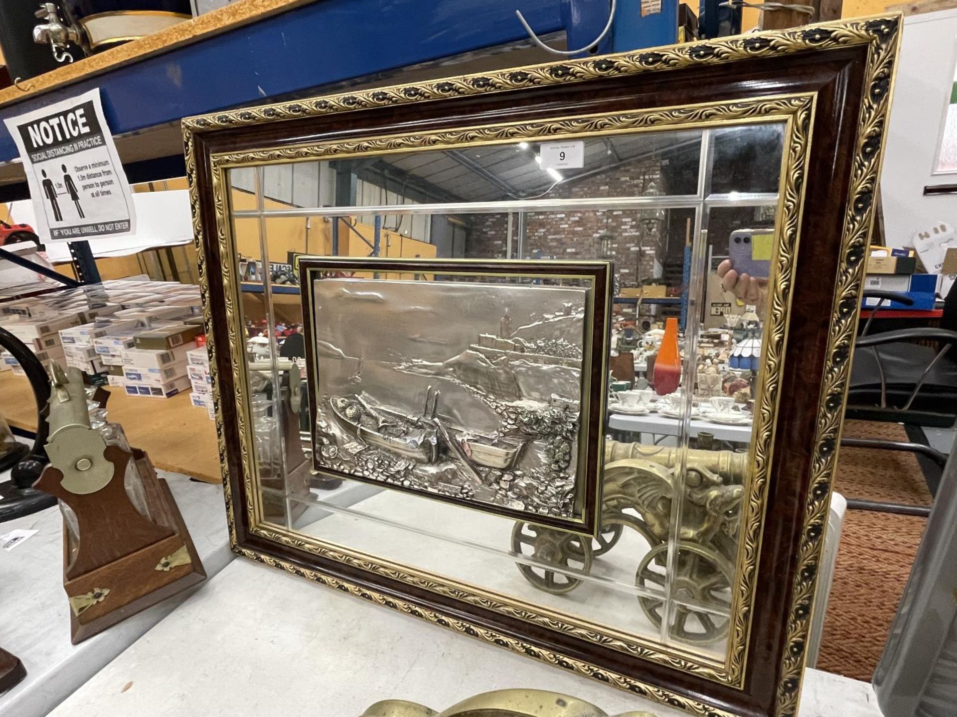 A LARGE GILT FRAMED MIRROR WITH A MARKED 925 SILVER PANEL