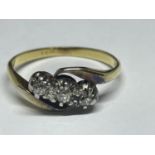 AN 18 CARAT GOLD RING WITH THREE IN LINE DIAMONDS ON A TWIST SIZE J/K IN A PRESENTATION BOX