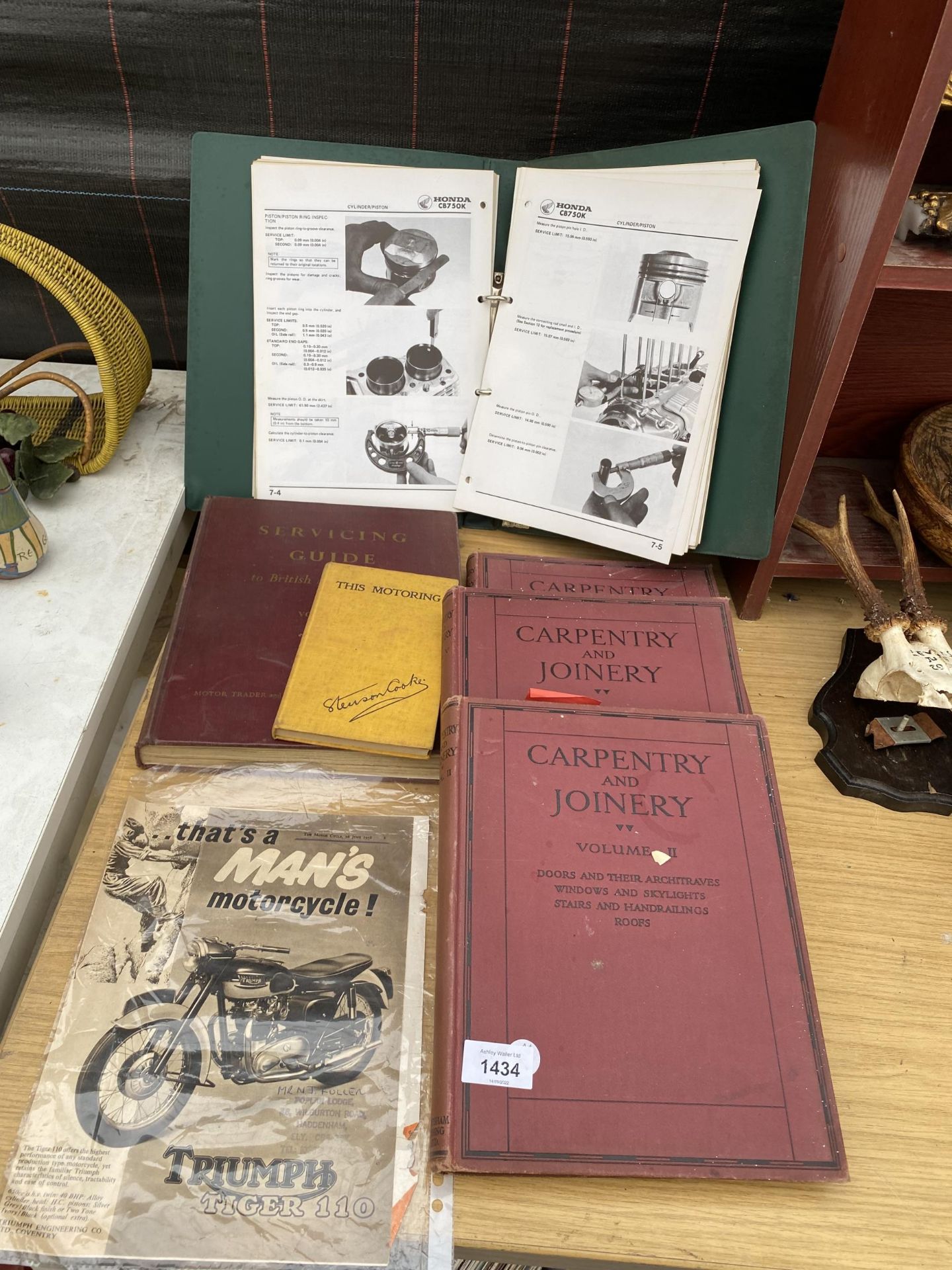 AN ASSORTMENT OF CARPENTRY BOOKS AND SERVICE BOOKS