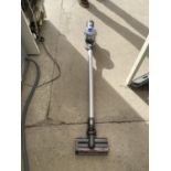 A DYSON V6 STICK VACUUM CLEANER BELIEVED IN WORKING ORDER BUT NO WARRANTY