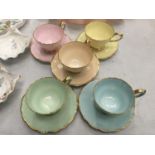 FIVE PARAGON CUPS AND SAUCERS IN DIFFERENT COLOURS