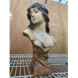 A RESIN FIGURE OF A FEMALE BUST STAMPED 'LINNOCENCE'
