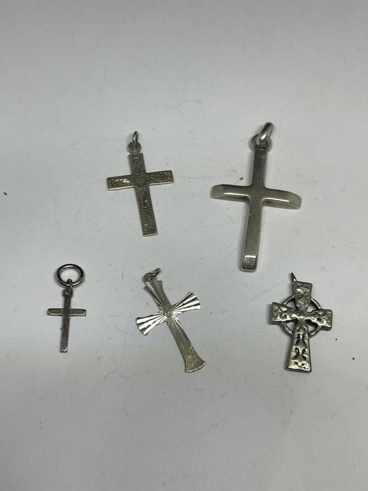 FIVE SILVER CROSSES