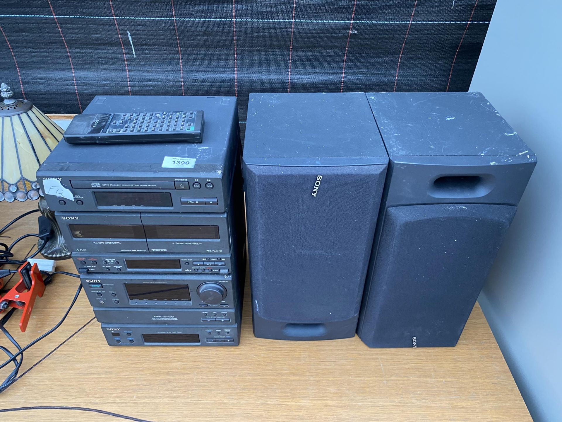 A SONY STEREO SYSTEM WITH CD PLAYER, TAPE PLAYER AND TUNER ALONG WITH TWO SPEAKERS