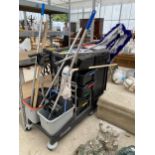 A LARGE INDUSTRIAL CLEANERS TROLLEY WITH BRUSHES, MOPS AND BUCKETS ETC