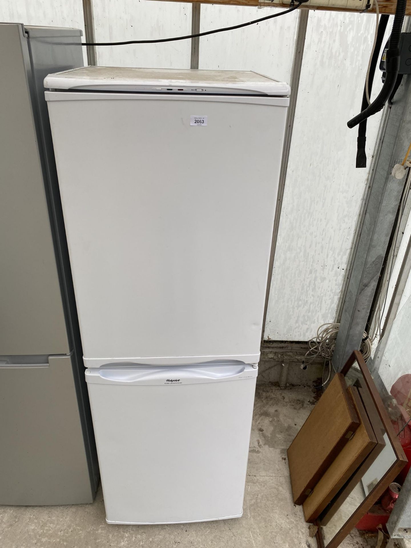 A WHITE HOTPOINT ICED DIAMOND UPRIGHT FRIDGE FREEZER