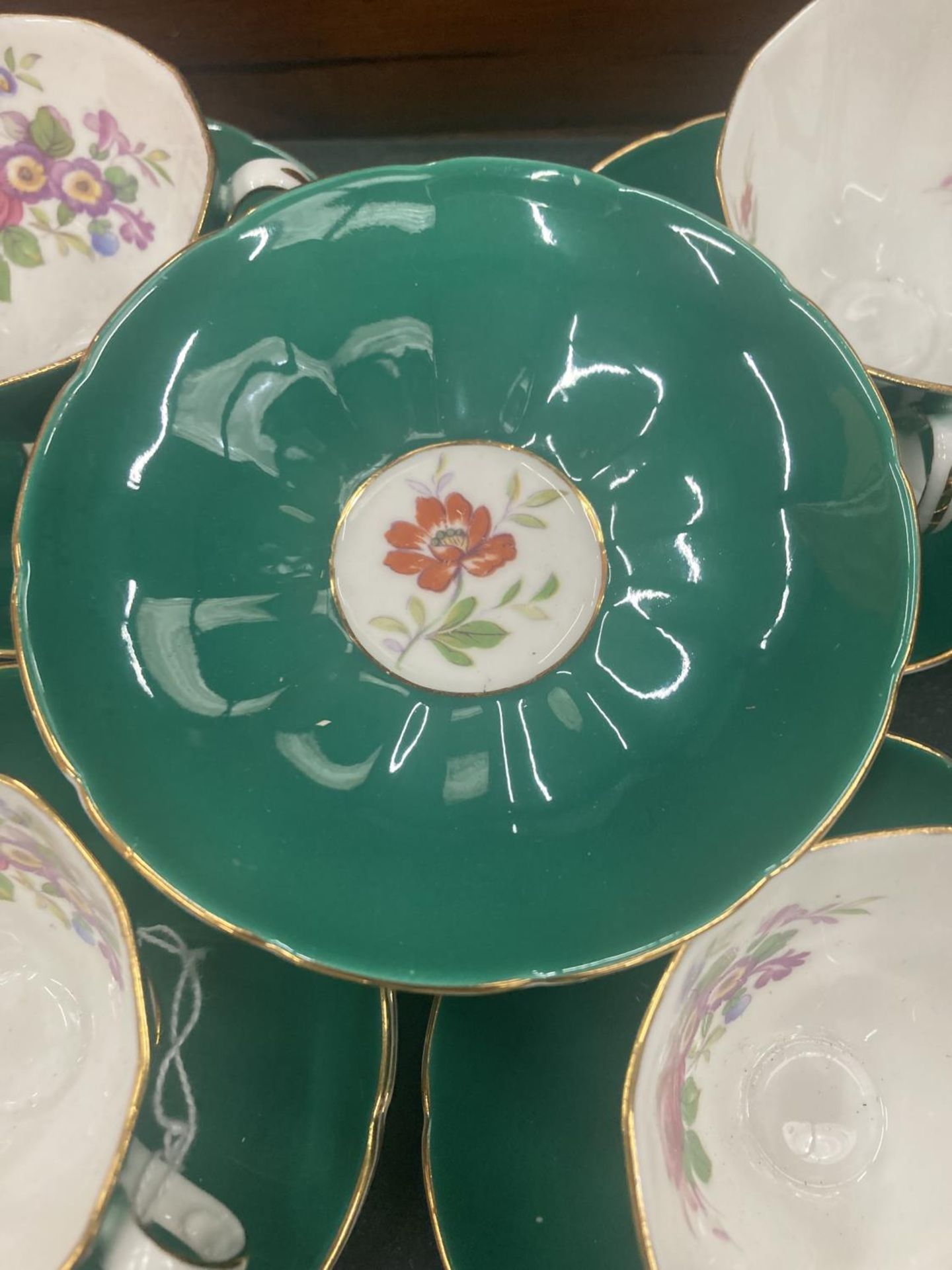 FIVE ADDERLEY CHINA CUPS AND SIX SAUCERS IN A DARK GREEN WITH A FLORAL PATTERN - Image 3 of 4