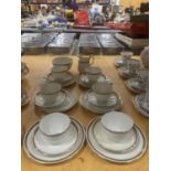 A PARAGON TEASET IN WHITE WITH GILT RIMS AND HANDLES TO INCLUDE CREAM JUG, SUGAR BOWL, CUPS, SAUCERS