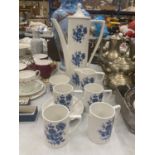 A PORTMEIRION PART COFFEE SET IN WHITE WITH A BLUE FLORAL PATTERN TO INCLUDE A COFFEE POT, CREAM