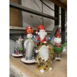 A COLLECTION OF CHRISTMAS RELATED ORNAMENTS TO INCLUDE A SNOWMAN, SANTA, ELF, CANDLES, ETC