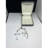A WATERFORD CRYSTAL CROSS ON A CHAIN IN A PRESENTATION BOX