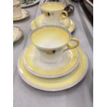 TWO ART DECO SHELLEY TRIOS, YELLOW WITH DECO DESIGN