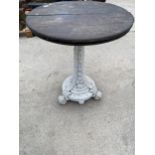 A 19TH CENTUARY COALBROOKDALE CAST IRON TABLE BASE WITH WOODEN TOP ON SCROLL FEET AND THE COLUMN
