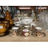 A FLORAL AND WHITE TEAPOT, IMARI PATTERNED CUPS AND SAUCERS, JUG, LOVING CUP, ETC