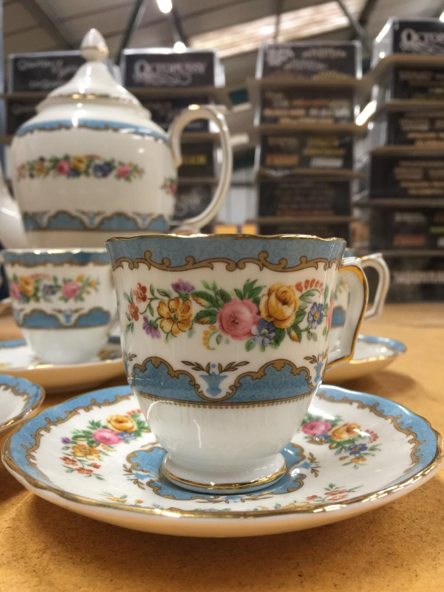 A CROWN STAFFORDSHIRE COFFEE SET IN A BLUE AND FLORAL PATTERN TO INCLUDE A COFFEE POT, CREAM JUG, - Image 2 of 4