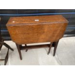 AN EDWARDIAN OAK SUTHERLAND TABLE