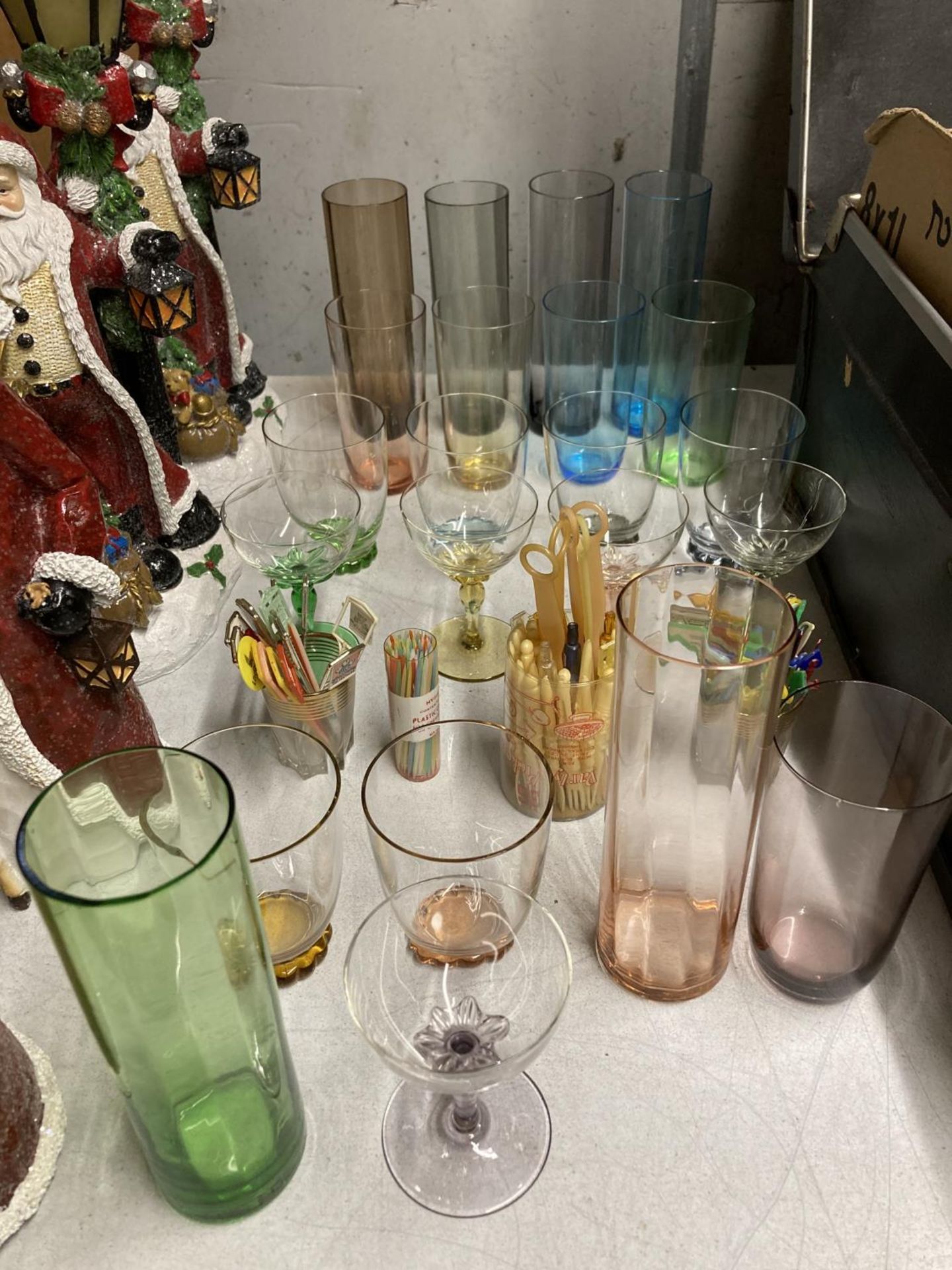 A QUANTITY OF COLOURED COCKTAIL GLASSES, TUMBLERS, COCKTAIL STICKS, ETC