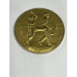 A YELLOW METAL MEDAL STAMPED 9CT