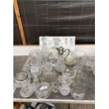 AN ASSORTMENT OF GLASS WARE TO INCLUDE TWO DECANTORS, BOWLS AND VASES ETC