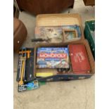 A TRAVEL CASE WITH AN ASSORTMENT OF GAMES AND TOYS TO INCLUDE A HARMONICA, MONOPOLY AND A A '