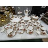 A LARGE COLLECTION OF ROYAL ALBERT OLD COUNTRY ROSES TO INCLUDE A COFFEE SET, CAKE STAND, BOWLS, EGG