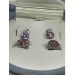 TWO PAIRS OF SILVER AND PINK STONE EARRINGS IN A PRESENTATION BOX