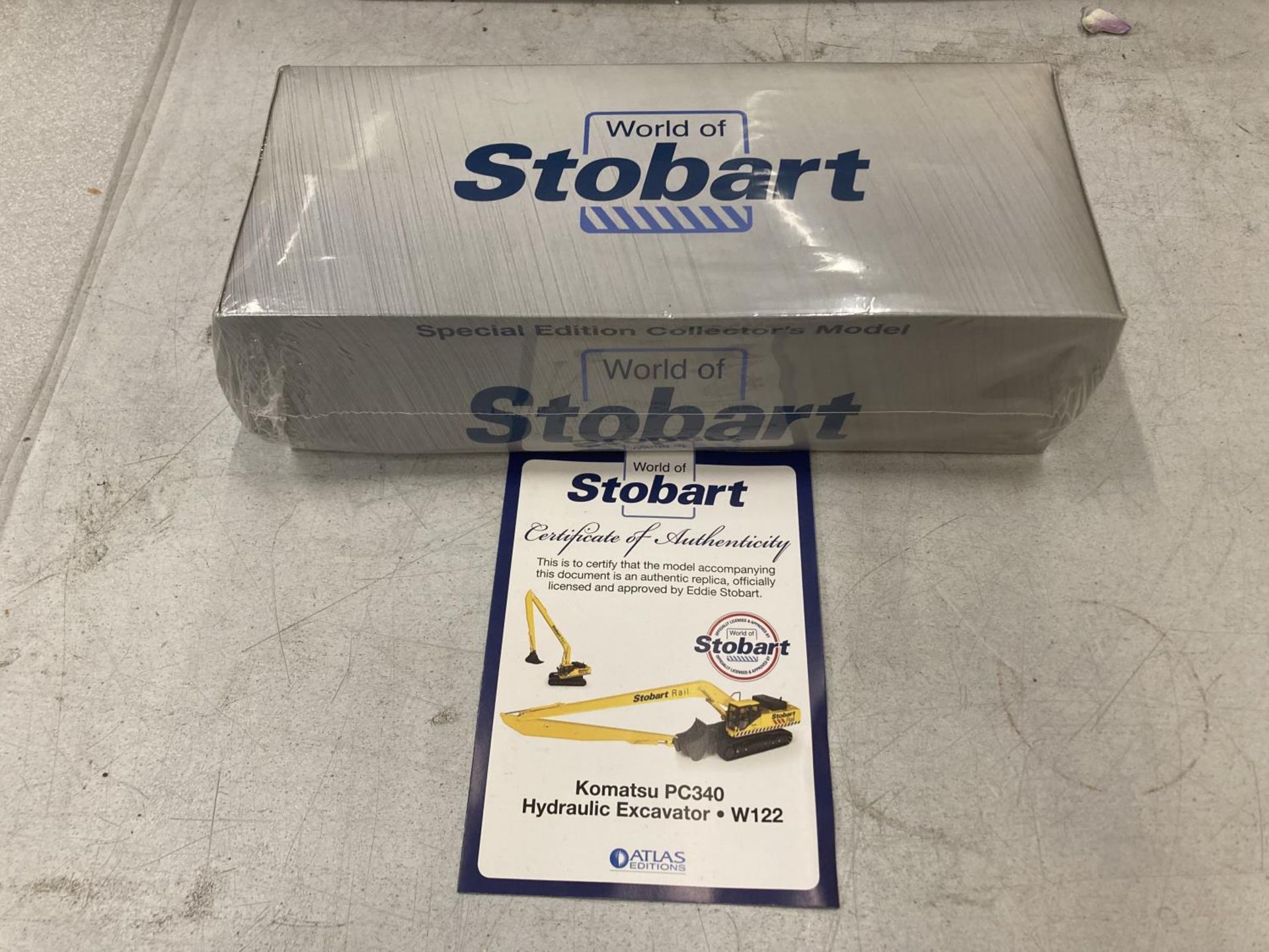 AN UNOPENED AND BOXED ATLAS EDITIONS WORLD OF STBART KOMATSU PC340 HYDRAULIC EXCAVATOR WITH