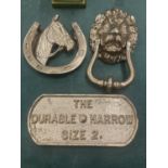 THREE PIECES OF BRONZE COLOURED CAST ITEMS TO INCLUDE A LION AND HORSE DOOR KNOCKER AND A PLAQUE