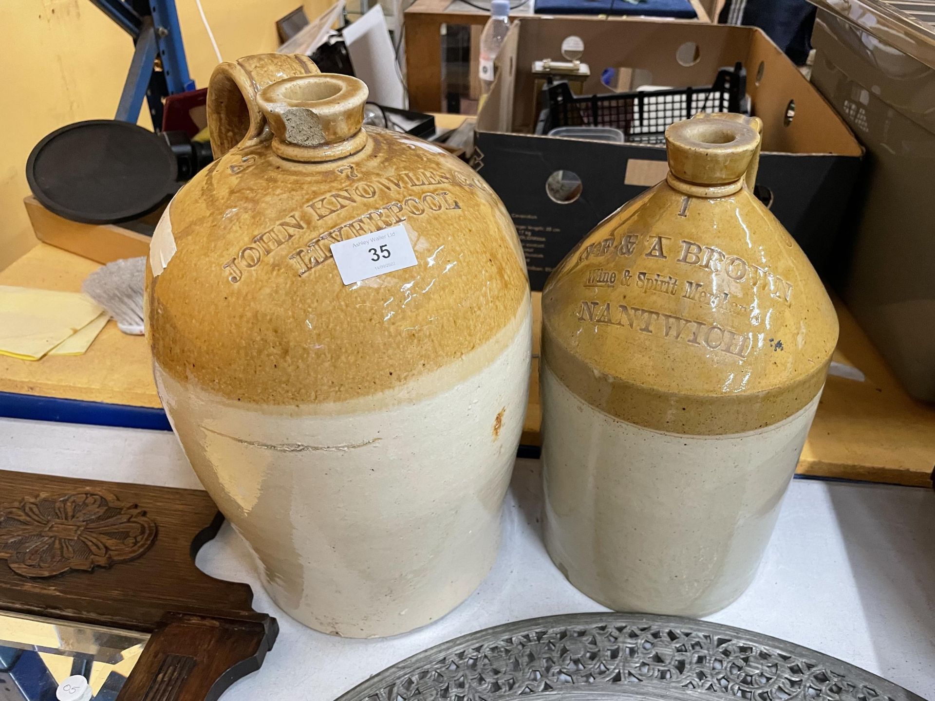TWO STONEWARE FLAGONS ONE JOHN KNOWLE AND SONS LIVERPOOL (CHIP TO TOP) AND G F AND A BROWN NANTWICH
