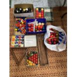 A LARGE QUANTITY OF POOL AND SNOOKER BALLS, CARPET BOWLS AND A SNOOKER SCORE BOARD ETC